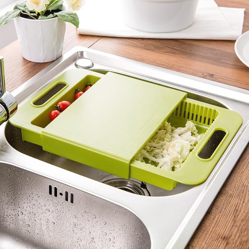 Green kitchen colander and cutting board setup, ideal for meal prep in the Kitchen Dining & Bar collection.
